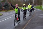 Photo: issi on bike waving.