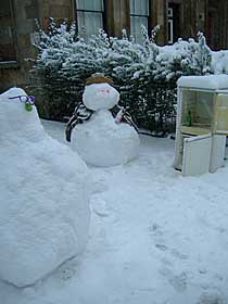 Photo: Snow man having a drink.