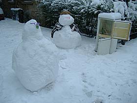 Photo: Snow man having a drink.