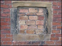 Photo: Bricked up window.