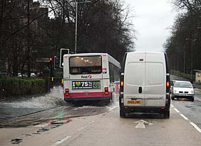 Bus on Great Western Road - going through puddle. Photo: Bus on Great Western Road - going through puddle.