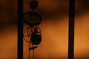 Wind chimes in the evening sun. Photo: Wind chimes in the evening sun.