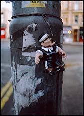 Photo: Guiness action man tied to pole.