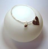 Photo: heart and charm bangle.