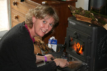 Photo: Issi lights the fire.