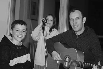Photo: Jim plays songs with the kids.