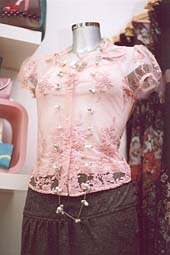 Photo: Pink top and necklace.