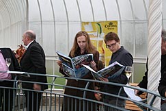 West End Festival - reading the programme. Photo: West End Festival - reading the programme.
