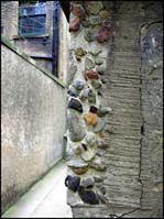 Photo: Stone in wall.