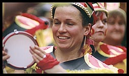 Photo: Festival parade: tamborine player.