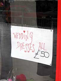 Photo: Sign: Wedding dresses only 50 pounds.