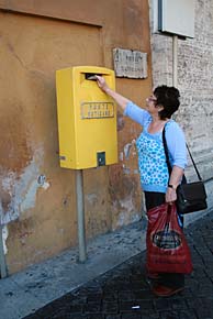 Photo: Pat posting postcards from Vatican post office.