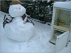 Photo: Snow man having a drink.
