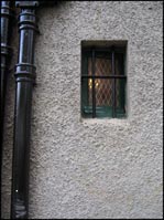 Photo: Small window and downpipe.