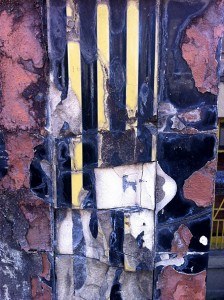 Brocken tiles on wall.