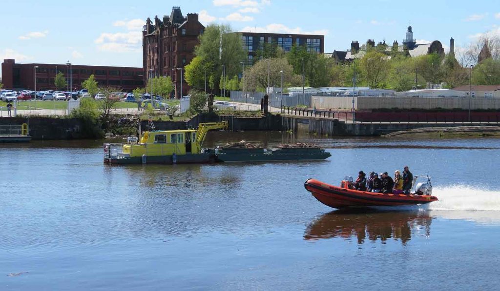 Power Boat and Floating Wood Collector. Govan