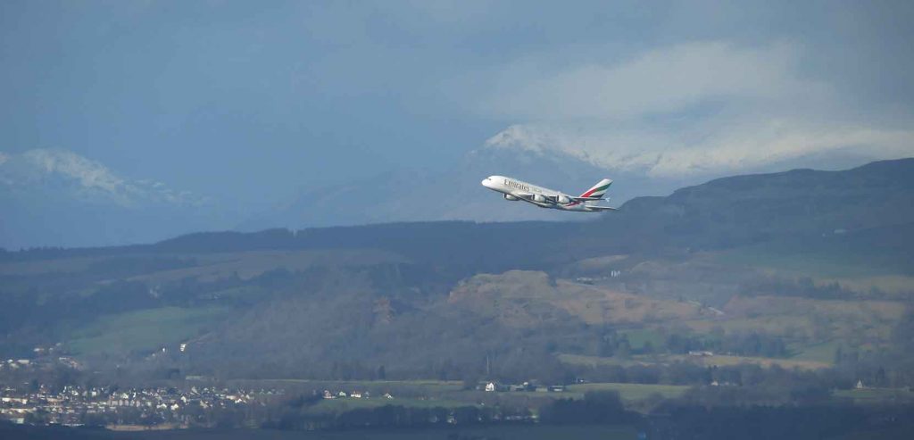Plane and Scottish Mountains